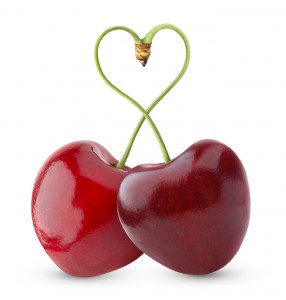 Pair of heart-shaped sweet cherries isolated on white